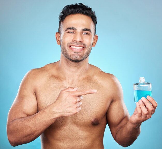 Man perfume and aftershave bottle for marketing advertising and mockup for glass container product placement and cosmetics Portrait of India model with a smile for parfum promo and aftershave