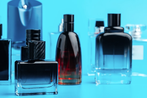 Man perfume bottle on blue  close up