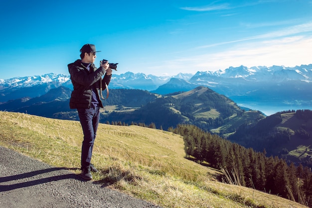 A man photograph mountain view, travel concept