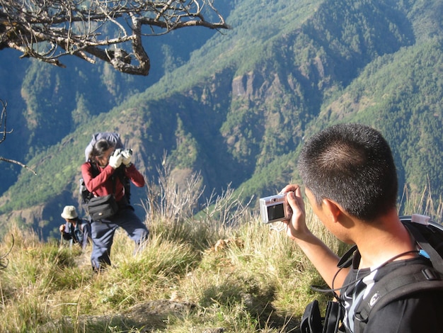 Man photographing through smart phone