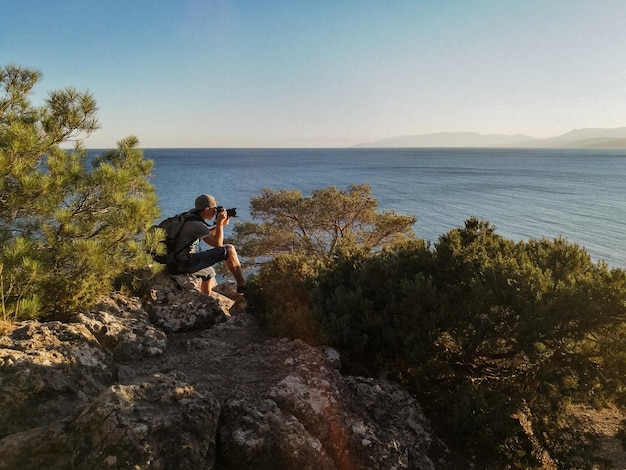 man photographs the sunset Landscape Photographer Beautiful nature Open space and sun Traveler