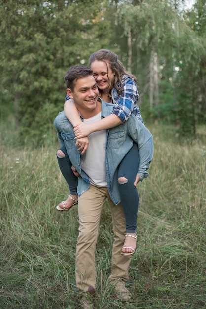 man piggybacking his girlfriend