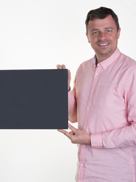 Man in pink with a blanck black board isolated