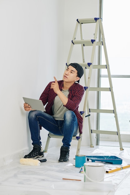 man planning maintenace in room
