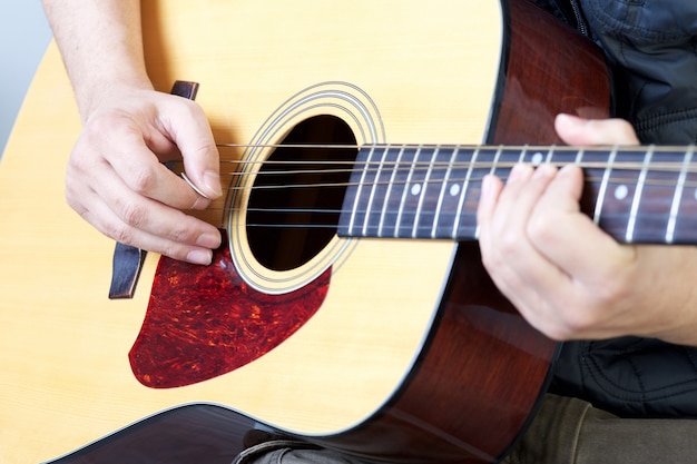 Man play acoustic guitar