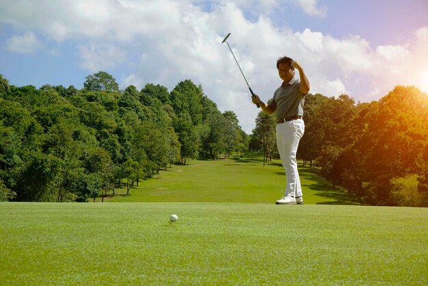 Man playing golf on field