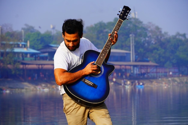 Man playing guitar on the boat