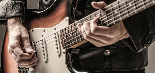 Man playing guitar Close up hand playing guitar Musician playing guitar live music