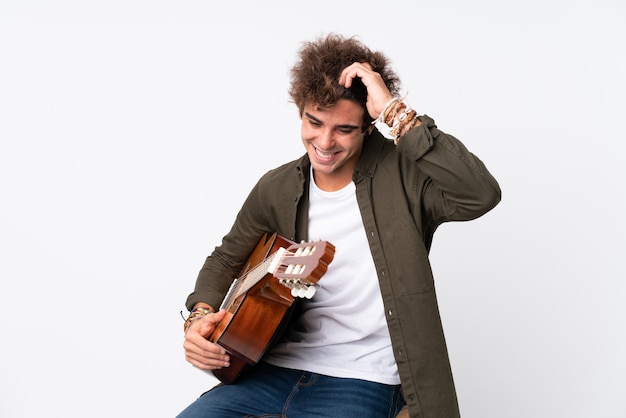 Man playing guitar over isolated wall