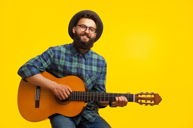 Man playing guitar in studio