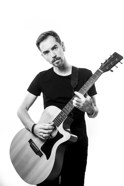 Man playing on the guitar on the white background.