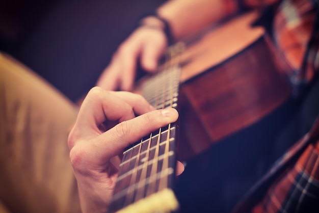 Man Playing On Guitar