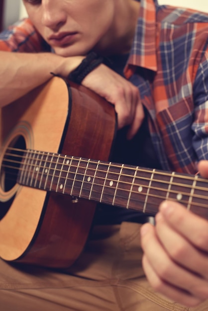 Man Playing On Guitar