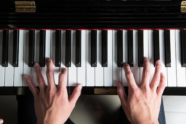 Man playing piano top view