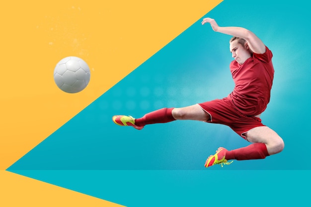 man playing soccer against colored background
