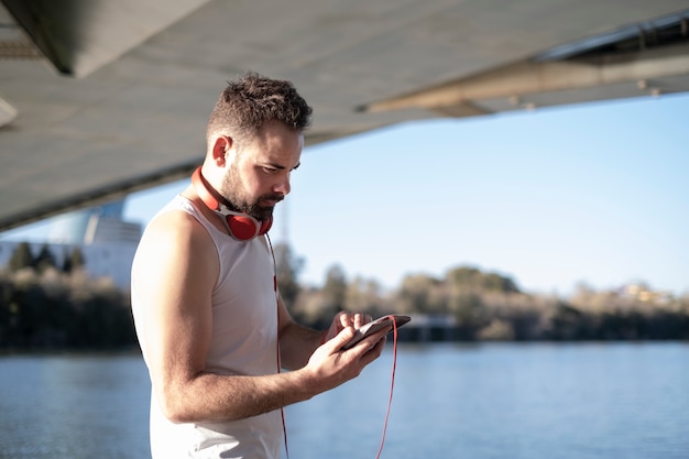 Man playing sports and listening to music with headphones