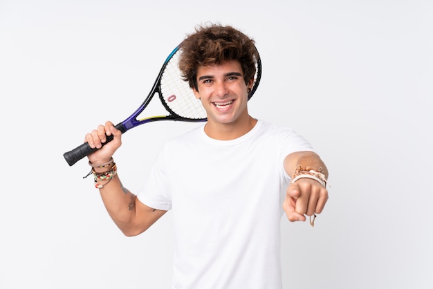 Man playing tennis over isolated wall