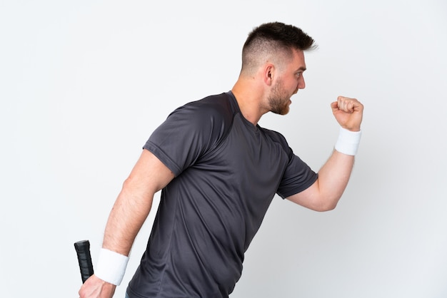 Man playing tennis over isolated