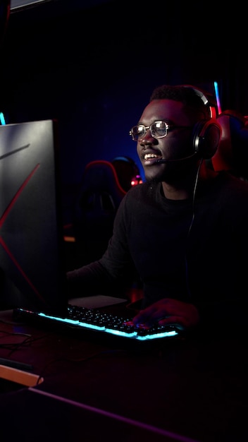 Man playing video game in darkroom