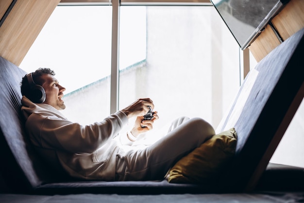 Man playing video games using joystick