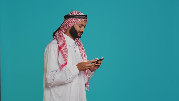 Photo man playing videogames on smartphone