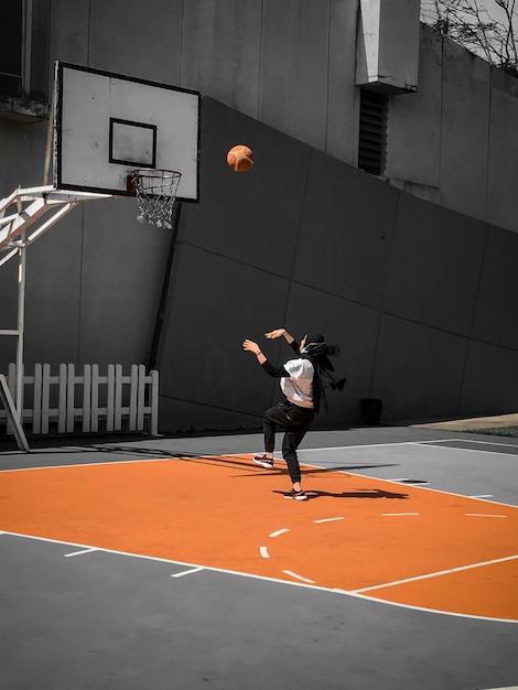 man playing with ball in background