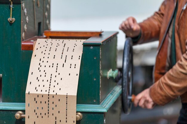 Man playing with a barrel organ