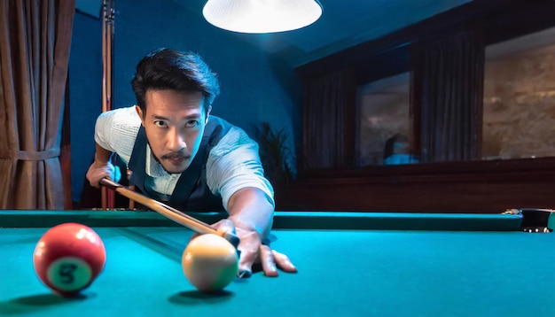 man plays billiards or pool on a pool table for his entertainment