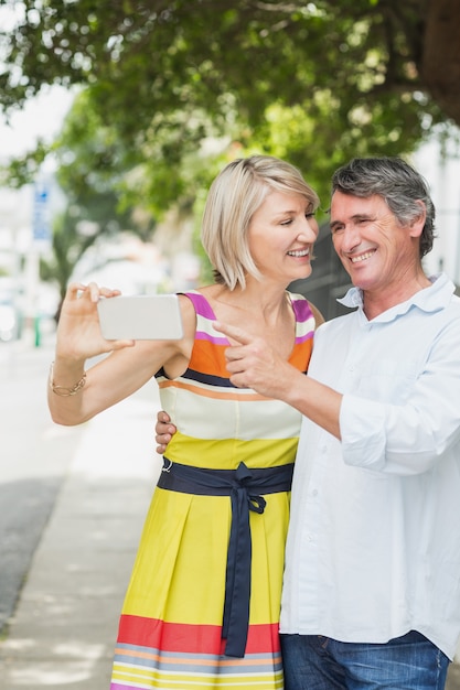 Man pointing at mobile phone