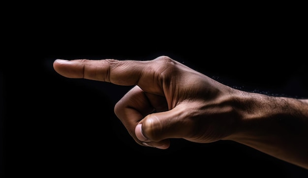 man pointing at an object against a black background in the style of tactile