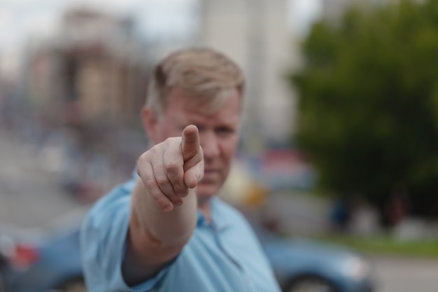 Man points his finger at you