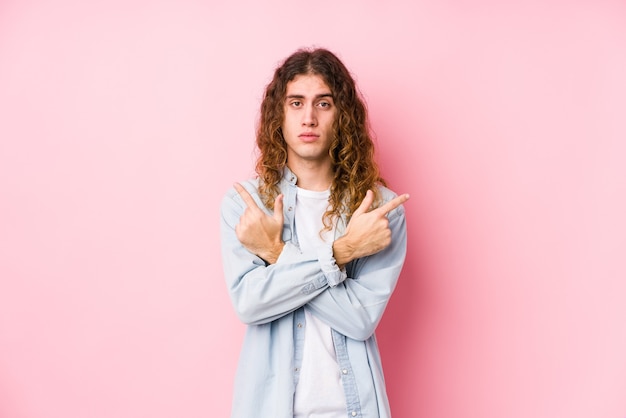 Man points sideways in studio