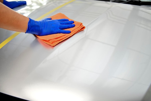 Man polishing car body