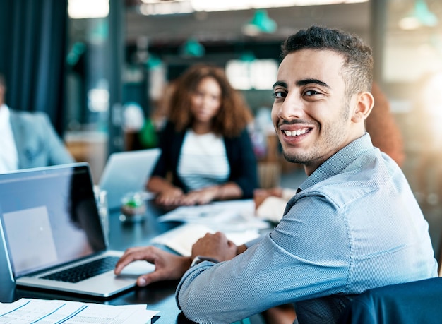 man portrait and happy at office meeting with laptop documents and confident at accounting firm person accountant and computer with paperwork for audit review and business people in workplace