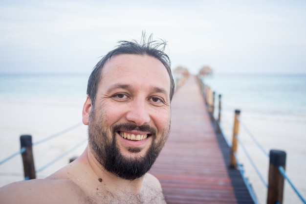 Man portrait on tropical pier