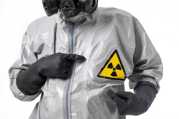 A man poses in a gray protective suit