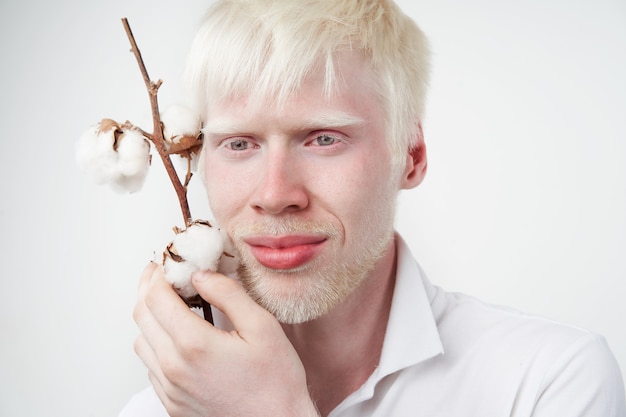 man posing with a cotton plant