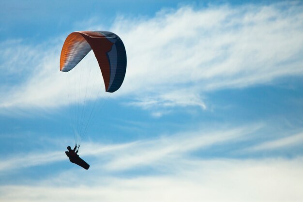 Man practicing paragliding extreme sport