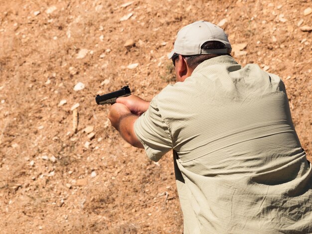 Man practicing target shooring.