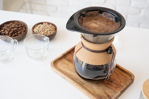 Photo man prepares coffee in style pour over