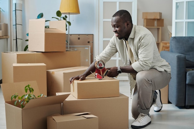 Man preparing boxes for relocation