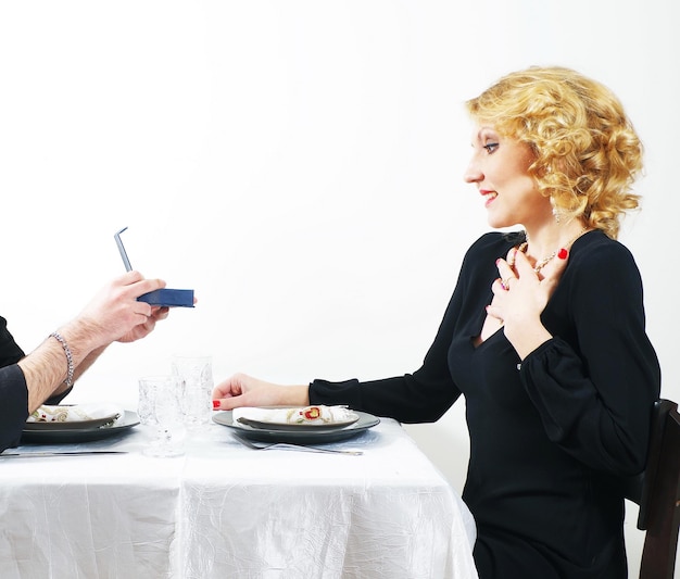 man presenting the gift to woman