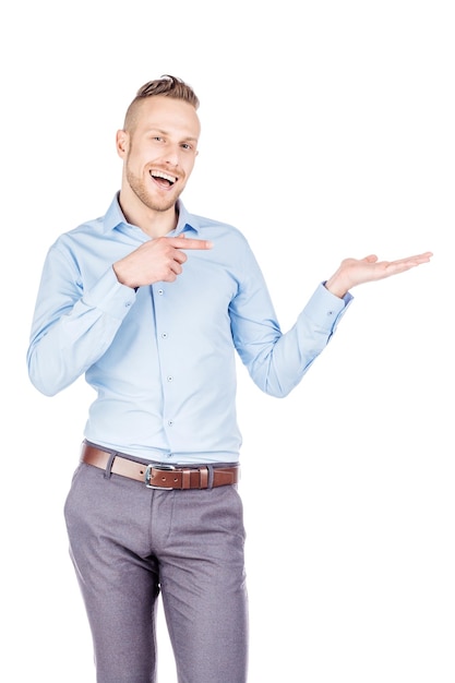 Man presenting or showing something your text or product human emotion expression and lifestyle concept image on a white studio background