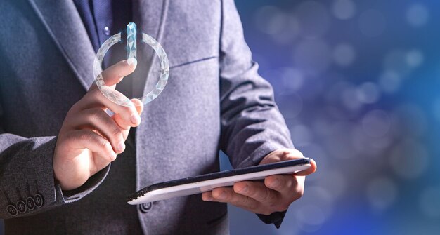 Man pressing virtual switch while holding phone