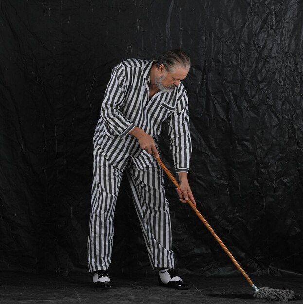 man in prison striped clothes