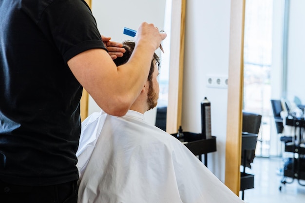 man at professional barbershop haircut lifestyle concept