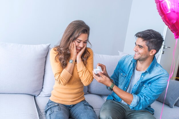 Man proposing to his beloved with beautiful engagement ring, closeup