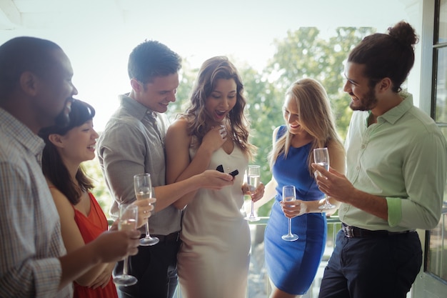 Man proposing woman with engagement ring