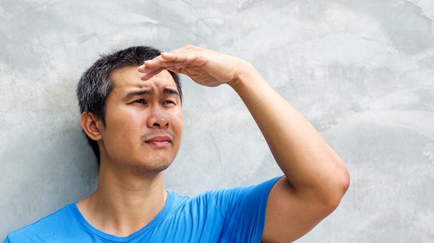 Man protect his eyes from sunlight