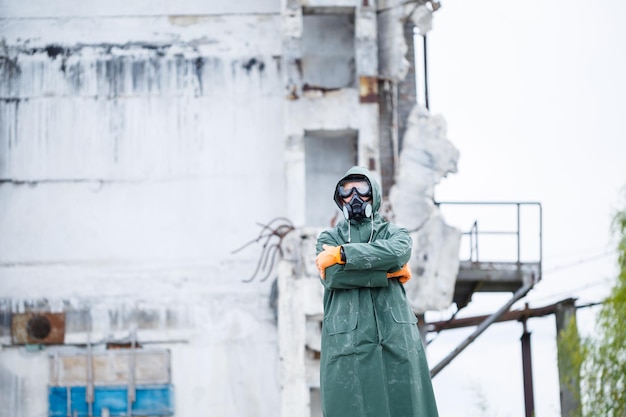 A man in a protective mask and protective clothing explores a
dangerous radioactive area